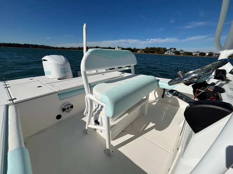 Slide: The Image of Interior view of a 2018 Robalo 246 Cayman boat on the water. - 18