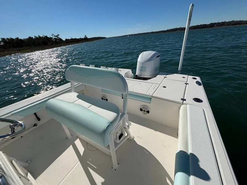 Slide: The Image of 2018 Robalo 246 Cayman boat on calm waters. - 19