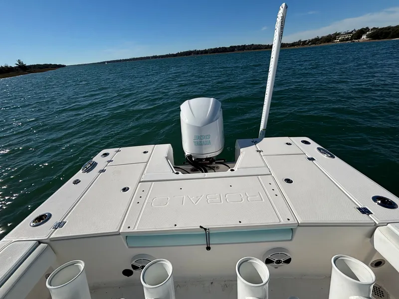 Slide: The Image of Robalo 246 Cayman 2018 on open water with outboard motor. - 21