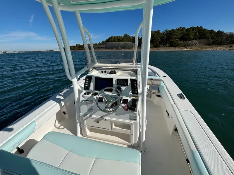 Slide: The Image of Interior view of a 2018 Robalo 246 Cayman boat on the water. - 26