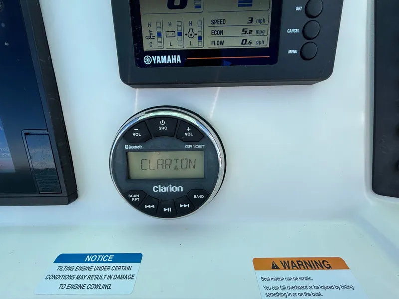 Slide: The Image of Yamaha display and Clarion control on 2018 Robalo 246 Cayman. - 31