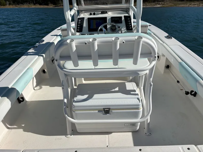 Slide: The Image of Interior view of a 2018 Robalo 246 Cayman boat on the water. - 35