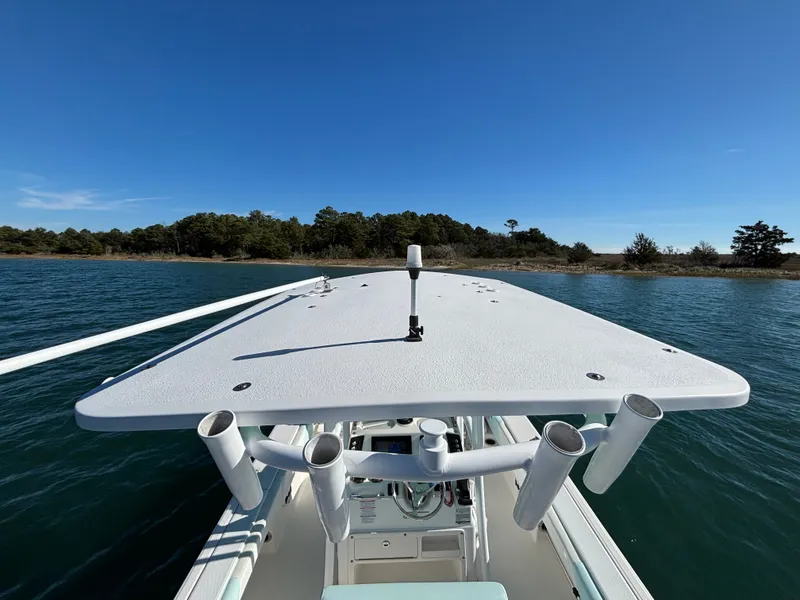Slide: The Image of 2018 Robalo 246 Cayman on calm water with clear sky. - 36