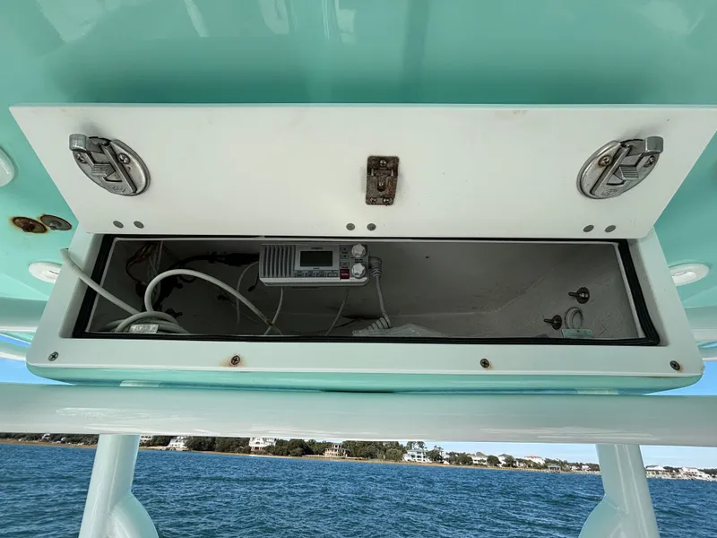 Slide: The Image of Open storage compartment on a 2018 Robalo 246 Cayman boat. - 38