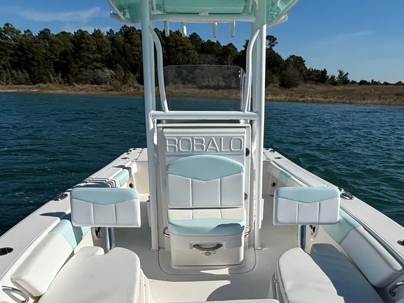 Slide: The Image of 2018 Robalo 246 Cayman boat on calm water. - 42