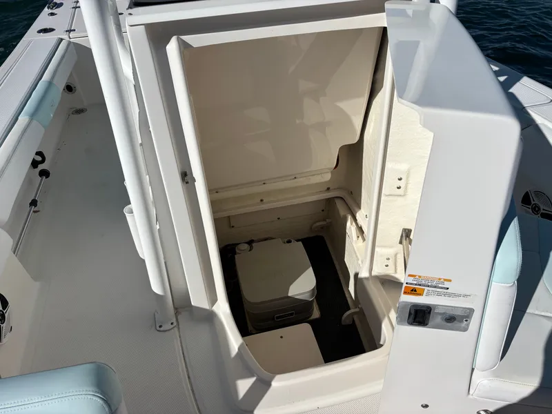 Slide: The Image of Interior of 2018 Robalo 246 Cayman with storage compartment. - 43