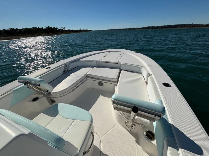 Slide: The Image of 2018 Robalo 246 Cayman boat on calm water. - 9