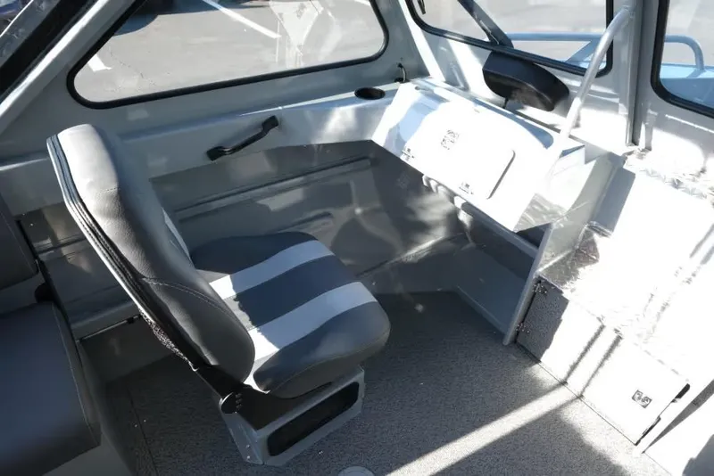 Slide: The Image of Interior of 2026 Hewescraft 180 Pro-V ET boat with seating and control panel. - 10
