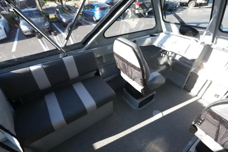 Slide: The Image of Interior of 2026 Hewescraft 180 Pro-V ET boat with seating and dashboard. - 14