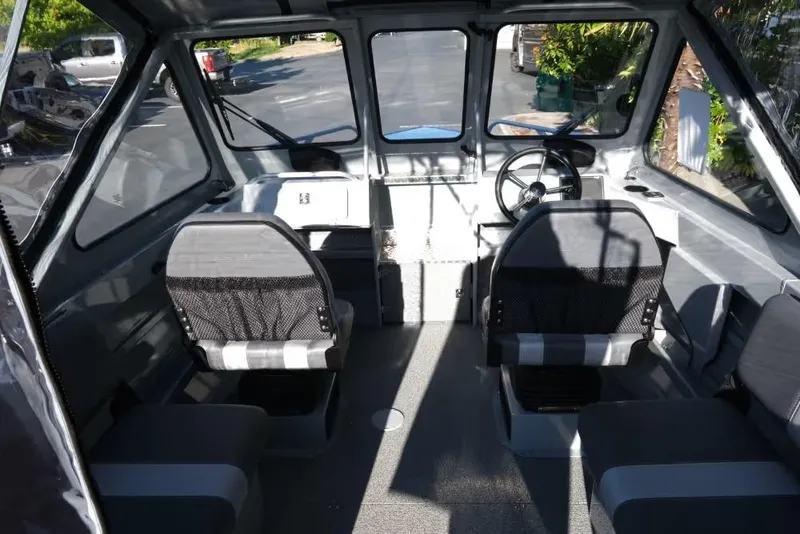 Slide: The Image of 2026 Hewescraft 180 Pro-V ET boat interior with seating and steering wheel. - 9