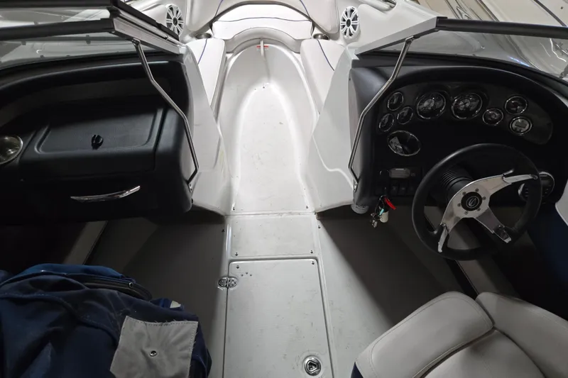 Slide: The Image of 2012 Crownline 195 SS boat interior with steering wheel and dashboard controls. - 24