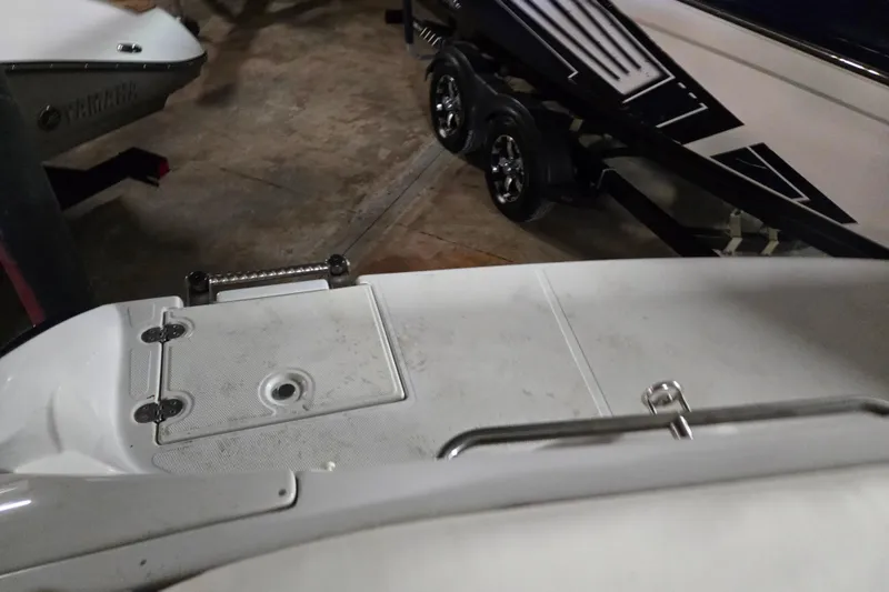 Slide: The Image of 2012 Crownline 195 SS boat with Yamaha engine, parked indoors on a trailer. - 28