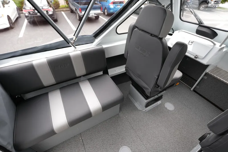 Slide: The Image of Interior of 2026 Hewescraft 190 SeaRunner ET boat, featuring seating and helm area. - 10