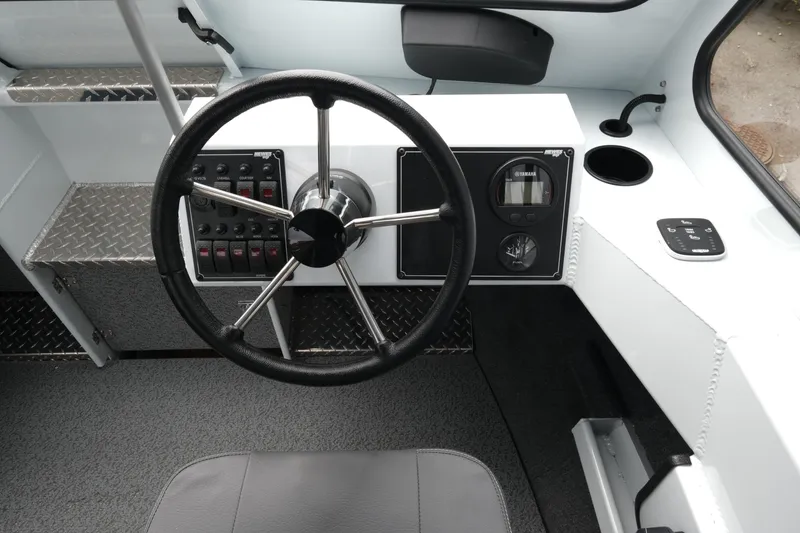 Slide: The Image of 2026 Hewescraft 190 SeaRunner ET dashboard with steering wheel and control panel. - 12
