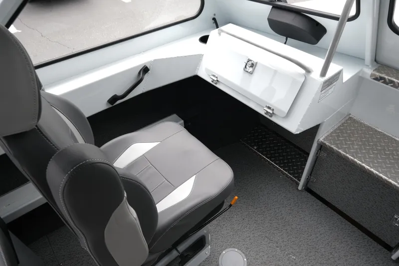 Slide: The Image of Interior of 2026 Hewescraft 190 SeaRunner ET boat, featuring seating and storage. - 14