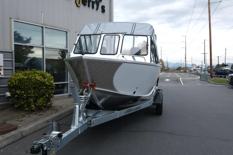 Slide: The Image of 2026 Hewescraft 190 SeaRunner ET boat on trailer outside dealership. - 3