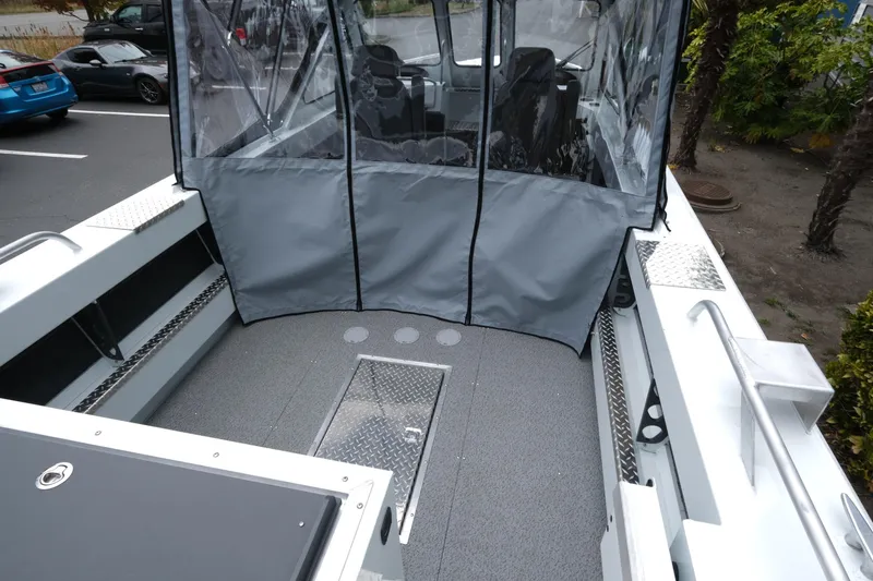 Slide: The Image of 2026 Hewescraft 190 SeaRunner ET boat interior with protective cover and seating. - 7
