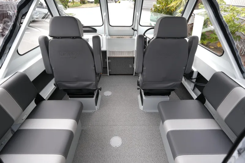 Slide: The Image of Interior of 2026 Hewescraft 190 SeaRunner ET boat, featuring modern seating and controls. - 9