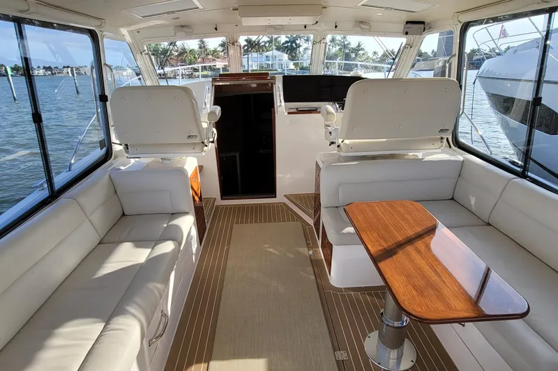 Slide: The Image of Luxurious interior of 2018 MJM 50z yacht with elegant seating and wooden table. - 17