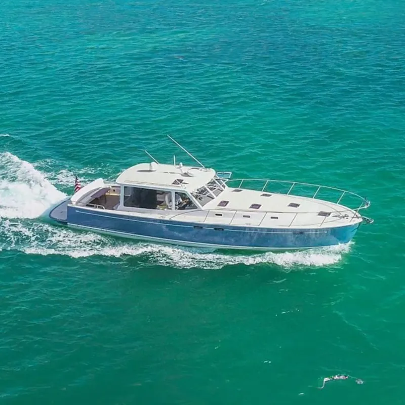 Slide: The Image of 2018 MJM 50z yacht cruising on clear turquoise waters. - 2