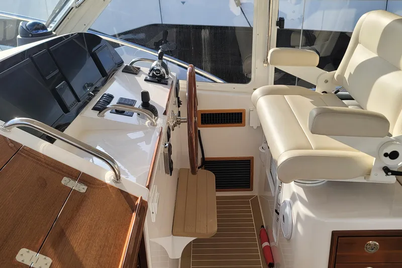 Slide: The Image of Luxurious helm of 2018 MJM 50z yacht with modern controls and comfortable seating. - 22