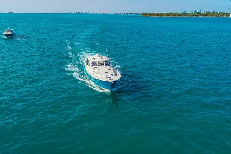 Slide: The Image of 2018 MJM 50z yacht cruising on clear blue ocean waters. - 3