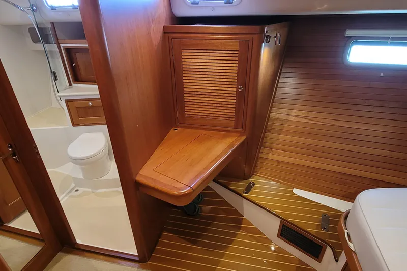 Slide: The Image of Interior of 2018 MJM 50z yacht featuring wooden cabinetry and bathroom. - 33