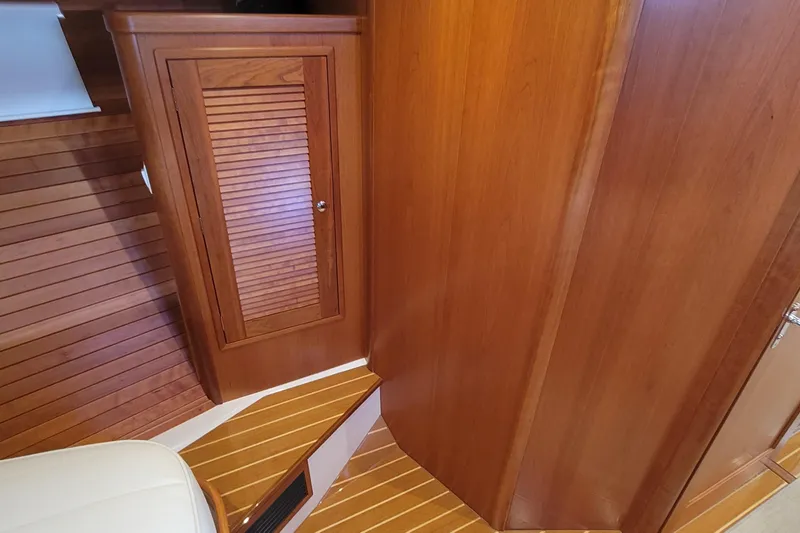 Slide: The Image of Interior of 2018 MJM 50z yacht featuring wooden cabinetry and flooring. - 34