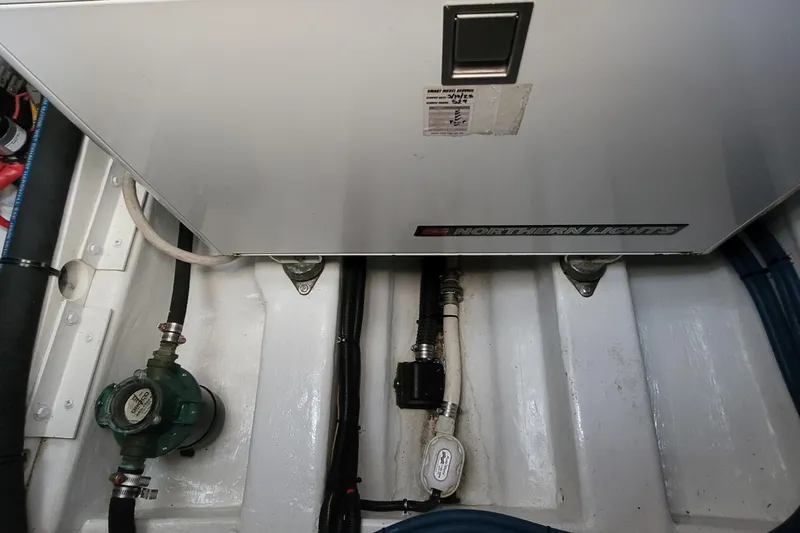 Slide: The Image of Engine room of 2018 MJM 50z with Northern Lights generator and plumbing components. - 42