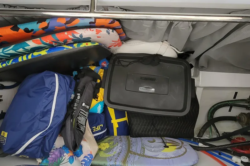 Slide: The Image of Storage compartment in 2018 MJM 50z boat with colorful gear and equipment. - 46