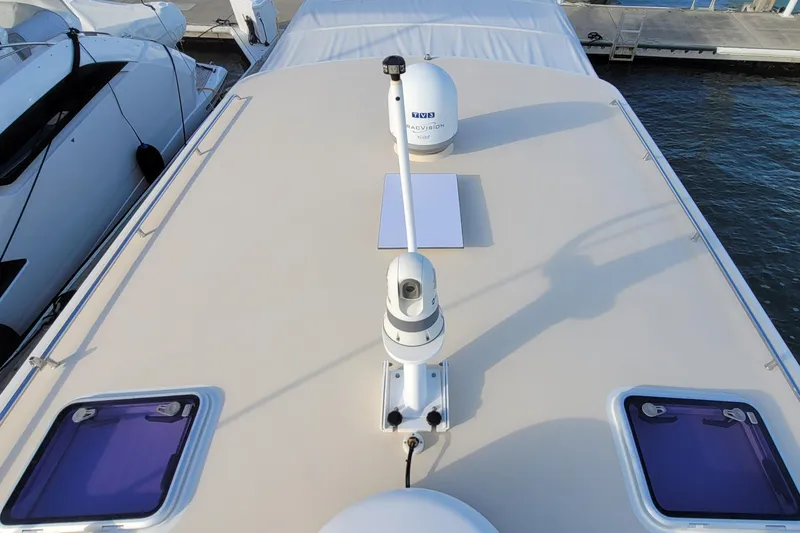 Slide: The Image of 2018 MJM 50z yacht deck with radar and hatches, docked at marina. - 50