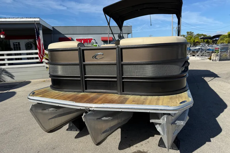 Slide: The Image of 2019 Crest Caribbean 250 SLS pontoon boat parked outdoors on a sunny day. - 3