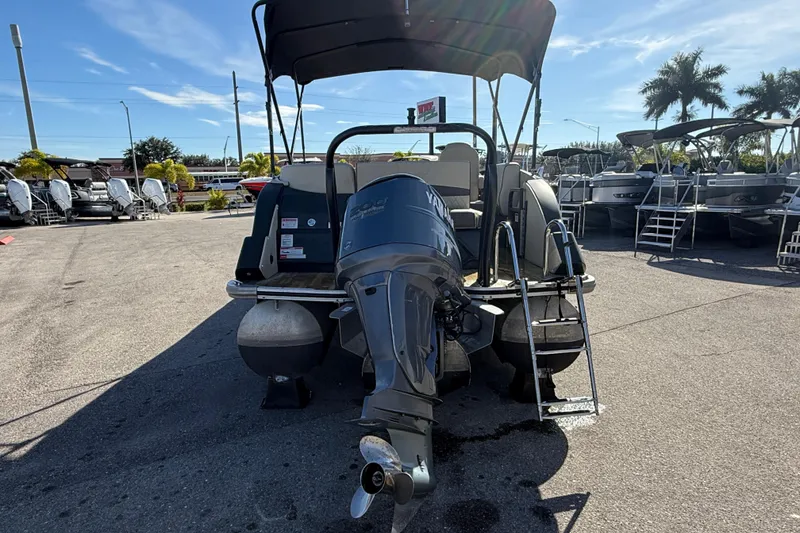 Slide: The Image of 2019 Crest Caribbean 250 SLS pontoon boat with Yamaha outboard motor in a sunny marina. - 7
