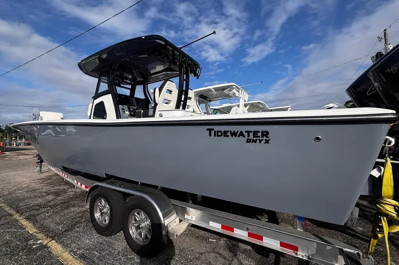 Slide: The Image of 2026 Tidewater 3100 Carolina Bay boat with spacious deck and modern seating. - 14