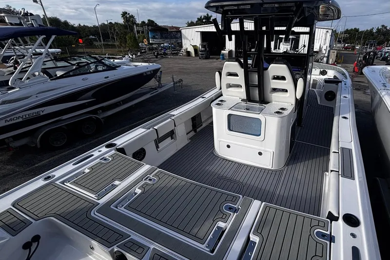 Slide: The Image of 2026 Tidewater 3100 Carolina Bay boat with dual outboard motors and Power-Pole anchors. - 15