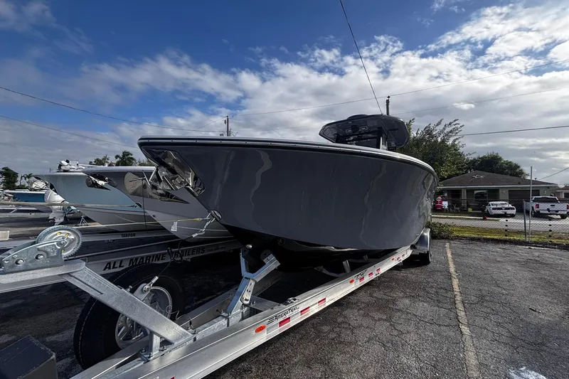 Slide: The Image of 2026 Tidewater 3100 Carolina Bay boat on trailer, viewed from the front. - 2