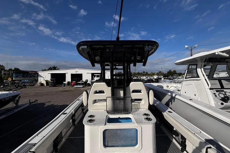 Slide: The Image of 2026 Tidewater 3100 Carolina Bay boat interior with modern helm and seating. - 21