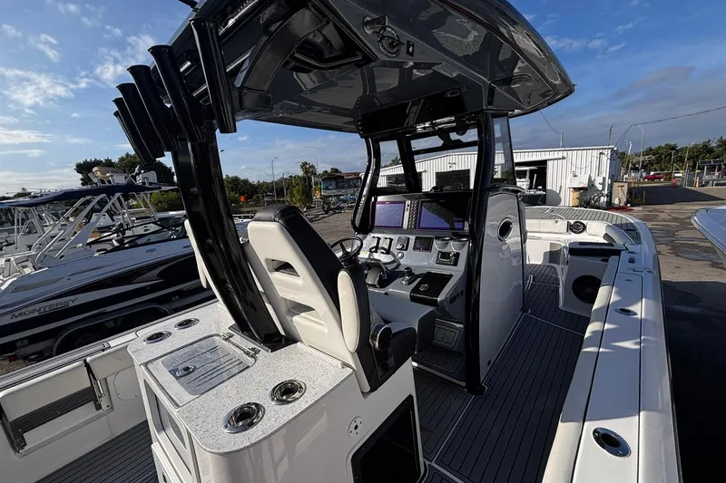 Slide: The Image of 2026 Tidewater 3100 Carolina Bay boat interior with dual seats and steering console. - 22
