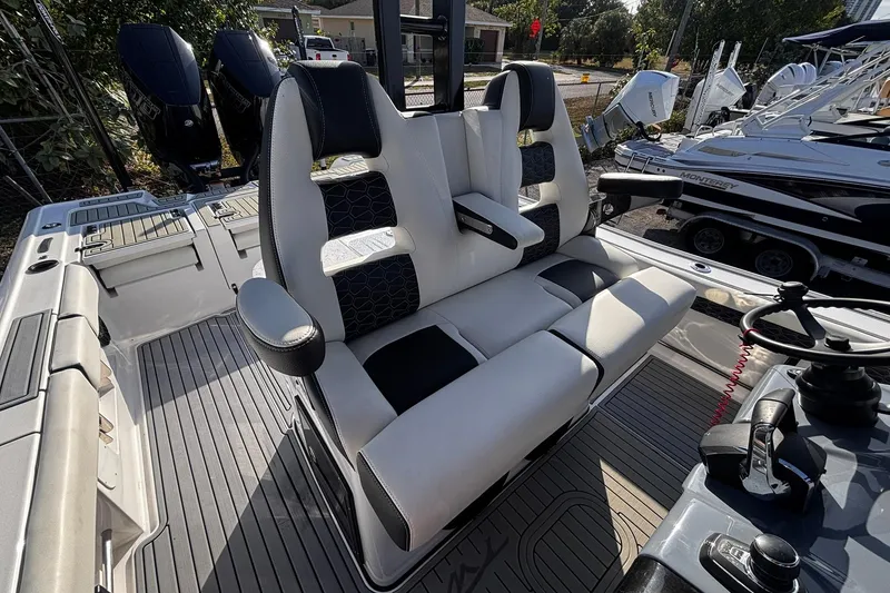 Slide: The Image of 2026 Tidewater 3100 Carolina Bay boat dashboard with advanced navigation system and controls. - 24