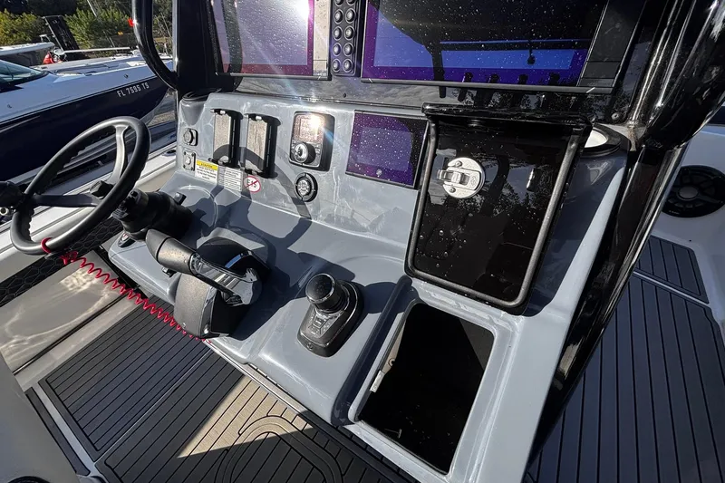 Slide: The Image of Joystick control on 2026 Tidewater 3100 Carolina Bay boat dashboard. - 26
