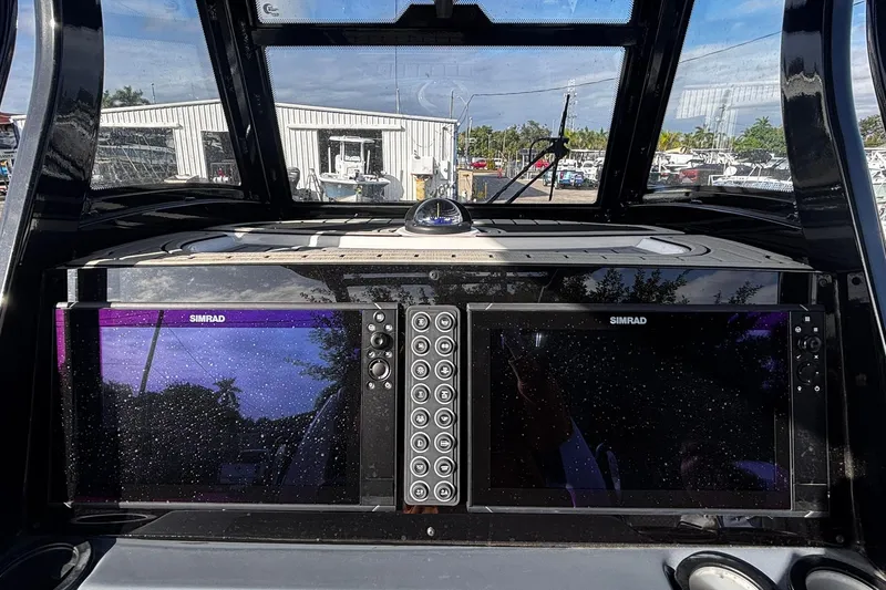 Slide: The Image of Control panel on 2026 Tidewater 3100 Carolina Bay boat with vent and accessory buttons. - 30