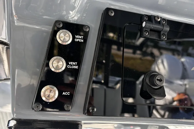 Slide: The Image of 2026 Tidewater 3100 Carolina Bay boat emblem and shower button detail. - 31