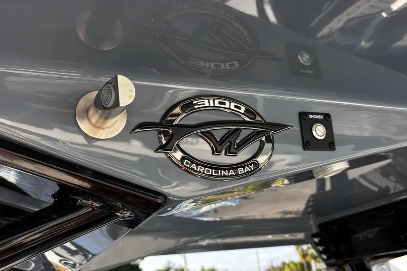 Slide: The Image of 2026 Tidewater 3100 Carolina Bay boat interior with speakers and storage compartment. - 32