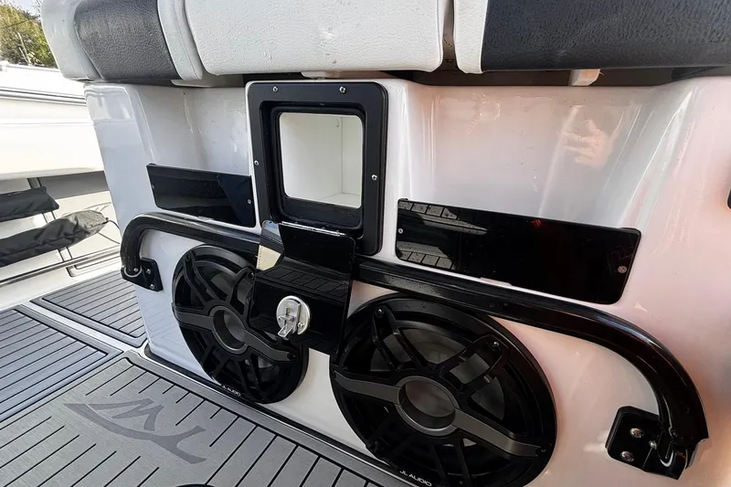 Slide: The Image of Close-up of 2026 Tidewater 3100 Carolina Bay boat seat and control panel. - 33