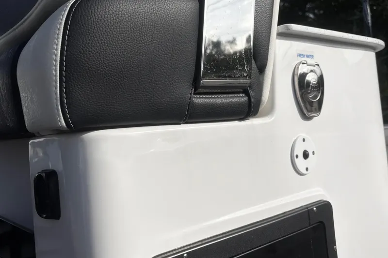 Slide: The Image of 2026 Tidewater 3100 Carolina Bay boat interior with sleek black door and modern design. - 34