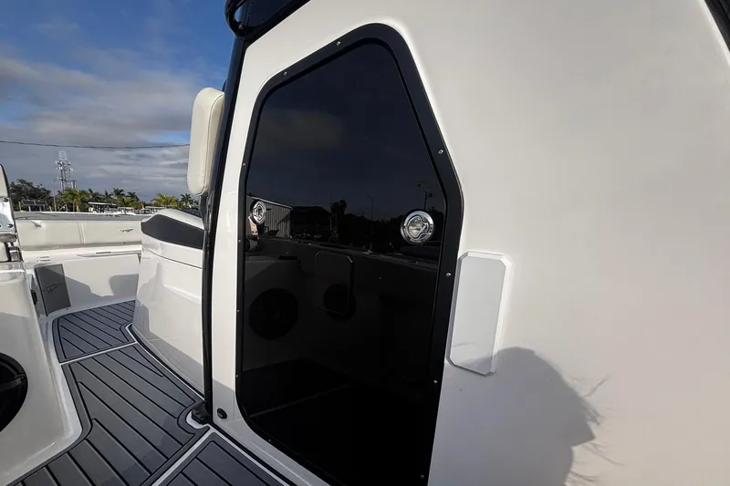 Slide: The Image of Interior of 2026 Tidewater 3100 Carolina Bay boat featuring a compact bathroom. - 35
