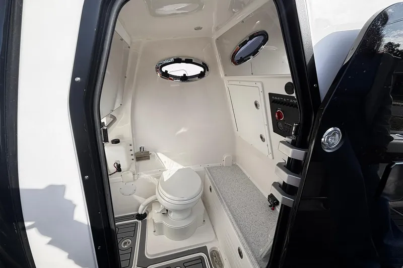 Slide: The Image of 2026 Tidewater 3100 Carolina Bay interior with control panel and portholes. - 36