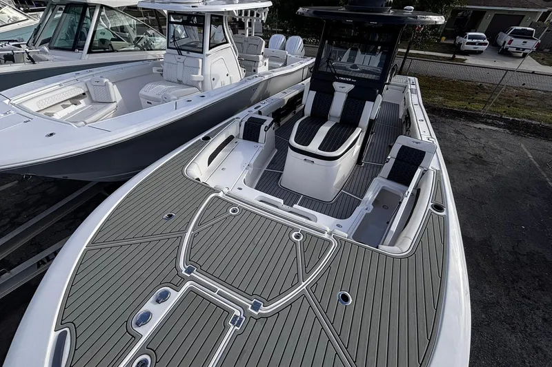 Slide: The Image of 2026 Tidewater 3100 Carolina Bay boat interior with open storage compartment and seating. - 46