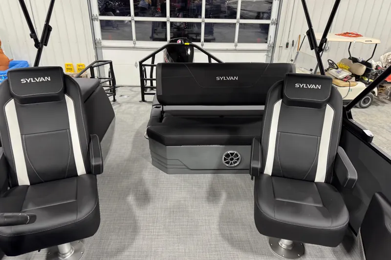 Slide: The Image of Interior of 2026 Sylvan X 5 boat with black seating and modern design. - 10