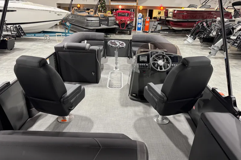 Slide: The Image of Interior of 2026 Sylvan X 5 boat with modern seating and steering console. - 7